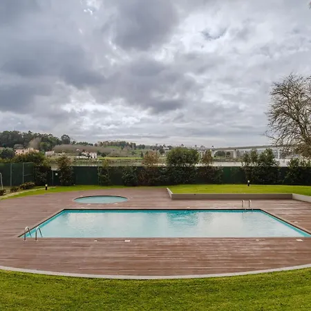 Hostwise - Elegant Riverfront Flat | Pool & Sports Daire